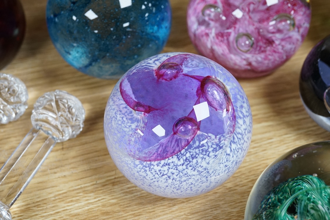 A collection of glass paperweights to include Caithness and millefiori examples, largest 10cm high